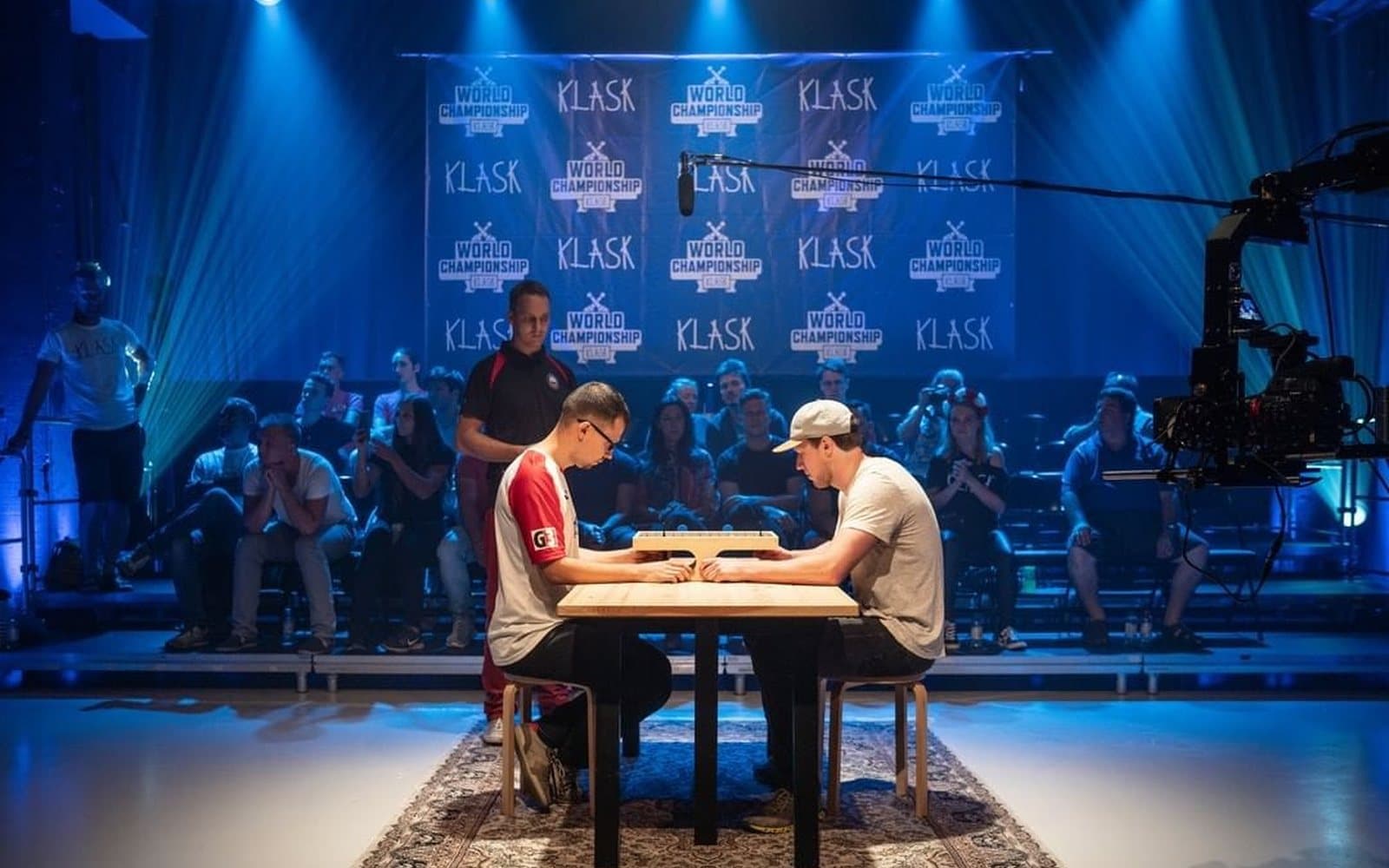 Two players facing off at the KLASK World Championship